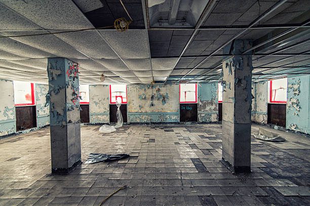 A room from an abandoned hospital building being prepped for asbestos removal and cleanup.